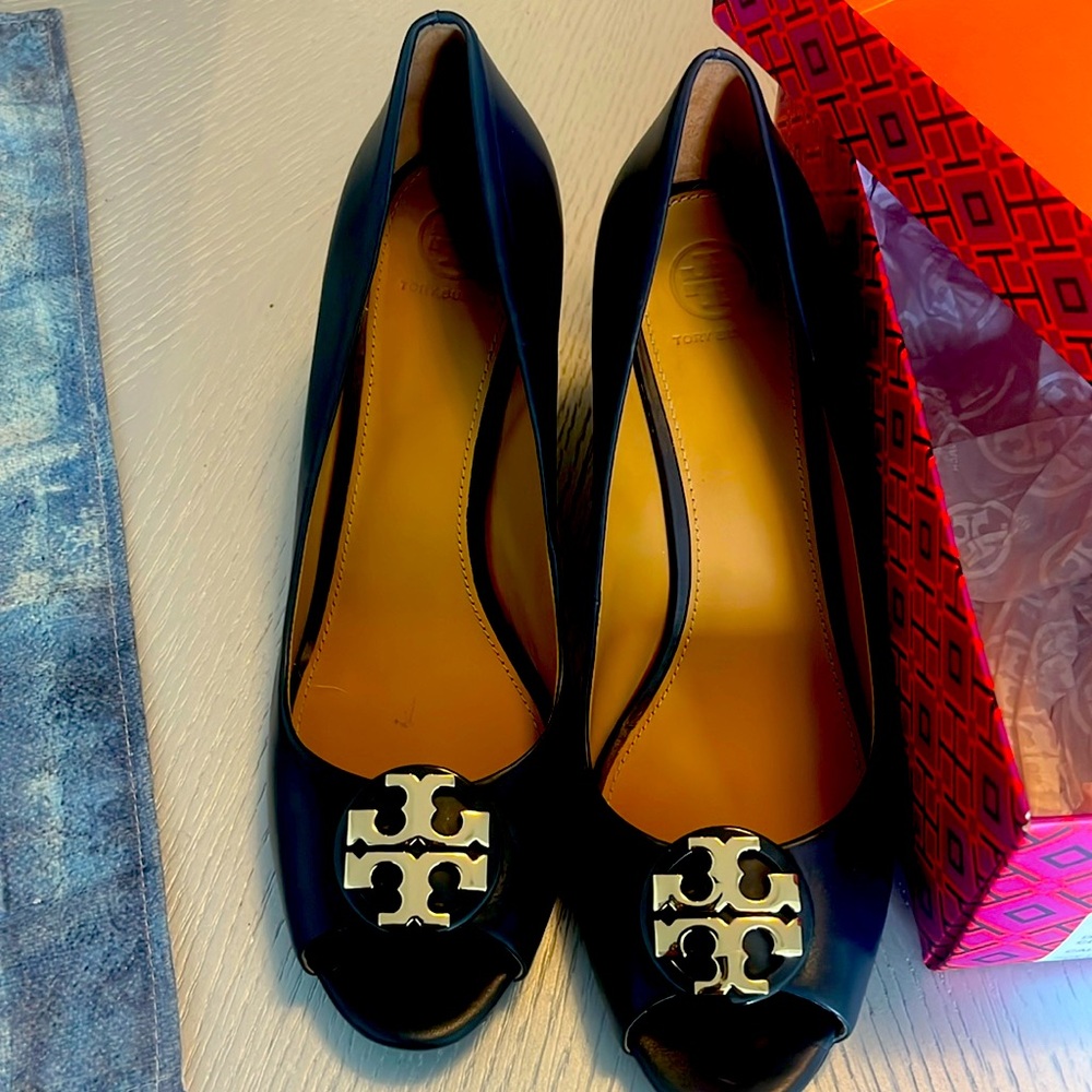 Barely worn.  Once or twice Claire navy open toed wedge.